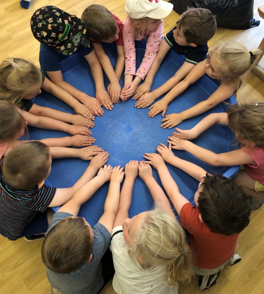 children's hands in a circle