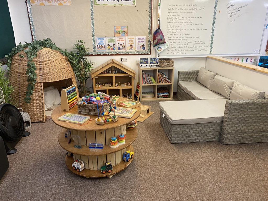 indoor caret space with sofa and den and sensory toys